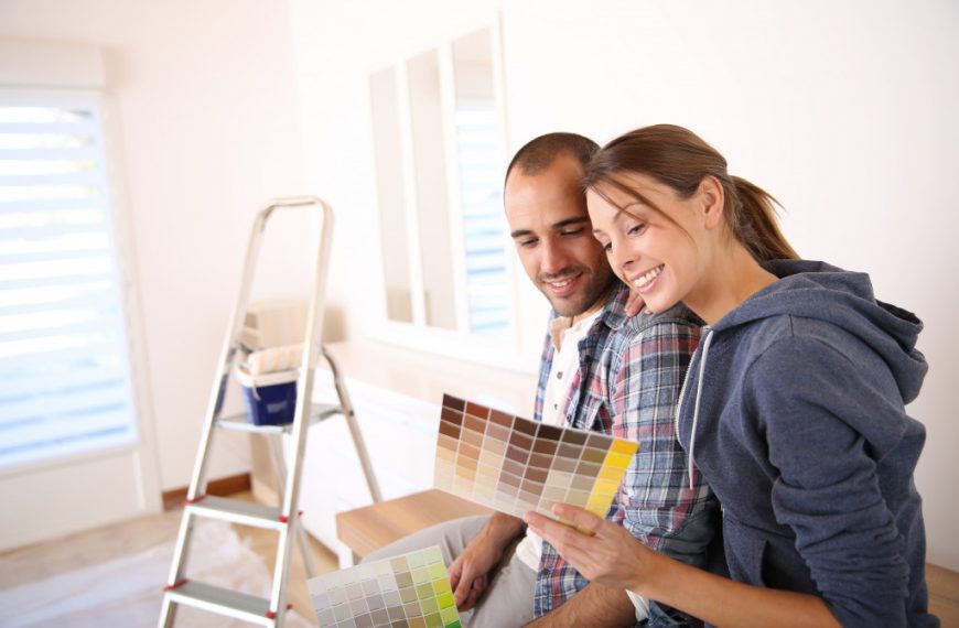 couples looking at different palettes of paint to choose from