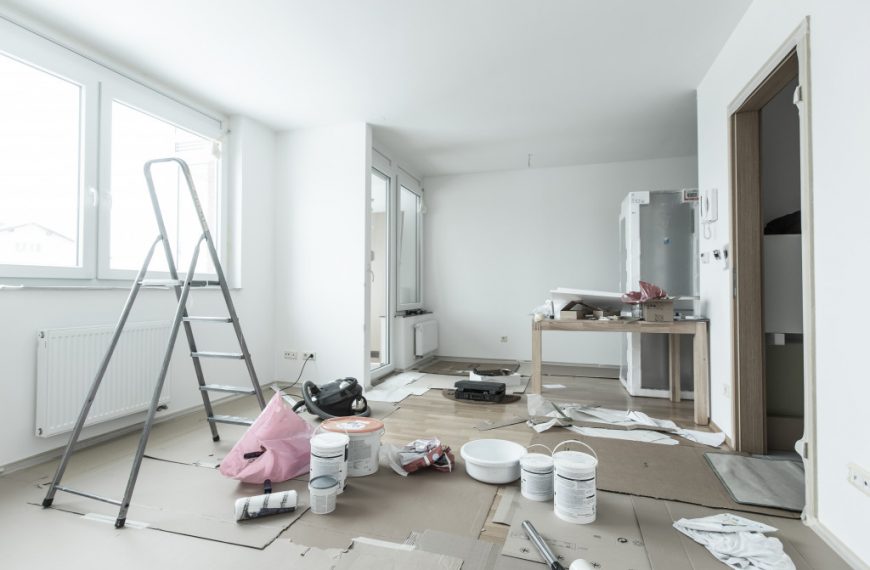 Home renovation in room full of painting tools