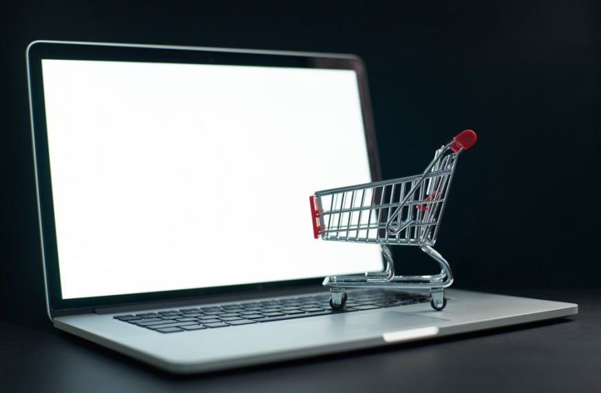 trolley cart on top of a laptop