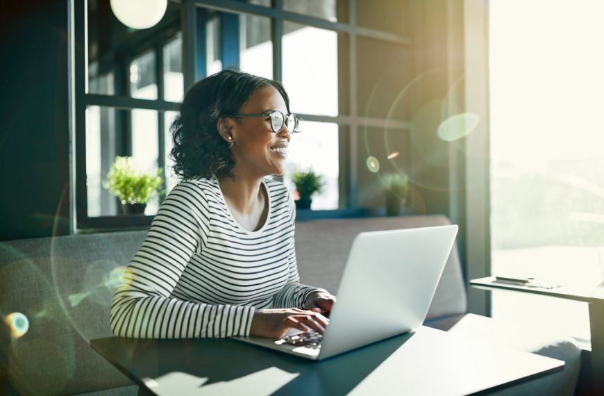 A woman working on her laptop at home