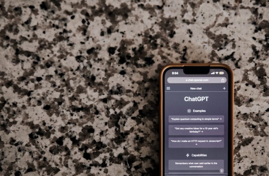 A cell phone with the app on it sitting on a granite countertop